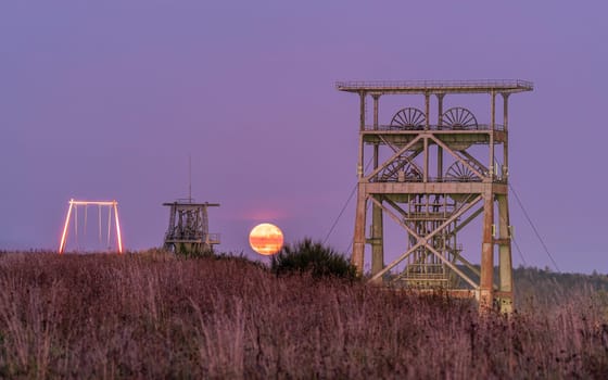 Headframe of old cold mine against sky, industrial heritage of Ruhr Metropolis, Dortmund, Germany