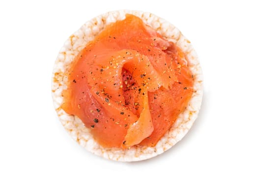 Tasty Rice Cake Sandwich with Fresh Salmon Slices Isolated on White - Top View. Easy Breakfast and Diet Food. Crispbread with Red Fish. Healthy Dietary Snack - Isolation