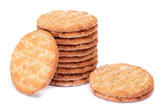 A Stack of Round Salt Crackers with Sesame Isolated on White Background. Dry Snacks - Isolation