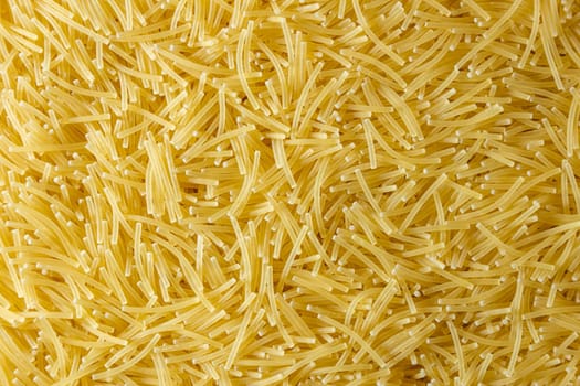 Uncooked Filini Pasta: A Culinary Canvas of Noodles, Creating a Lively and Textured Background for Gourmet Cooking. Dry Pasta. Raw Macaroni - Top View, Flat Lay