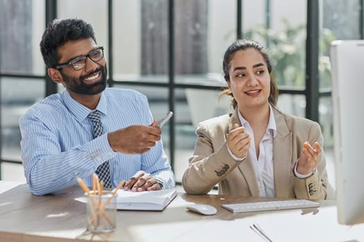 Startup business partners working together in desktop