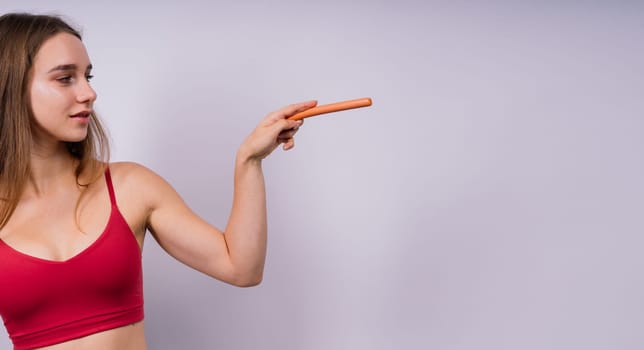 Woman opened her mouth and wants to bite off a sausage, close-up