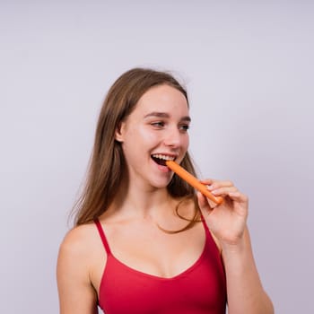Woman opened her mouth and wants to bite off a sausage, close-up