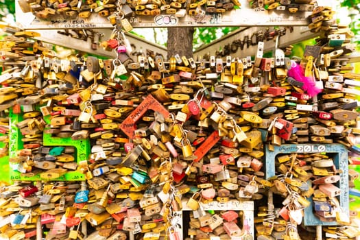 Paris, France - 23 February, 2023: Many wedding locks attached on bridge