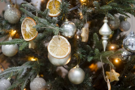 Christmas tree decorations and citrus slices , year 2024