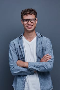 portrait of a young man on a gray background.