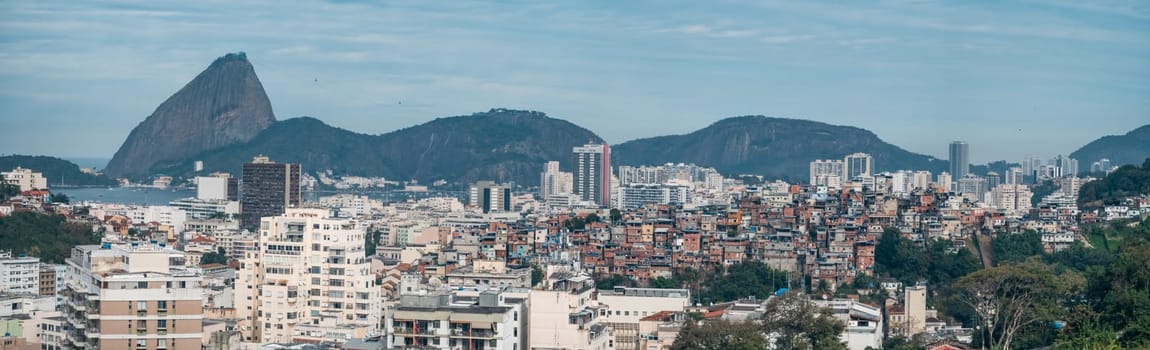 Rio's skyline blends modern structures and favelas against Sugarloaf Mountain's backdrop.