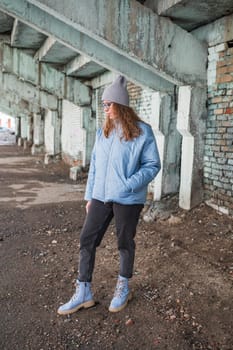 Portrait of a stylish woman in blue jacket. Spring outdoor portrait.