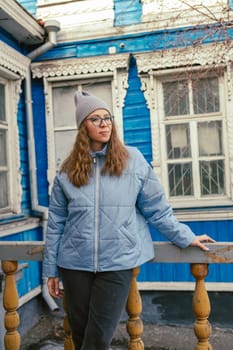 Portrait of a stylish woman in blue jacket. Spring outdoor portrait.