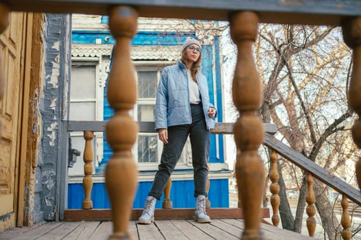 Portrait of a stylish woman in blue jacket. Spring outdoor portrait.