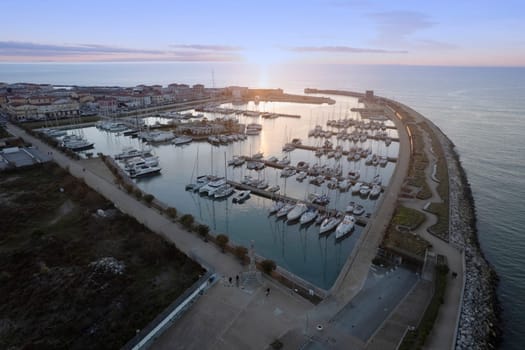 Aerial photographic documentation of the port of Marina di Pisa at sunset 