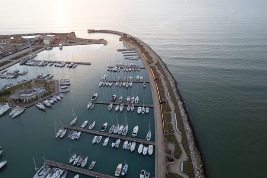 Aerial photographic documentation of the port of Marina di Pisa at sunset 