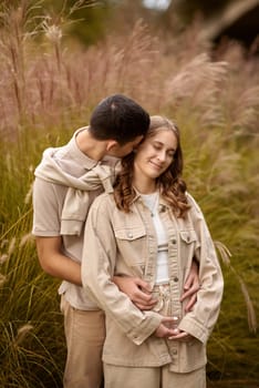 Young Cute Female Hugs Boyfriend. In Autumn Outdoor. Lovers Walking in Park. Attractive Funny Couple. Lovestory in Forest. Man and Woman. Cute Lovers in the Park. Family Concept. Happy Couple.