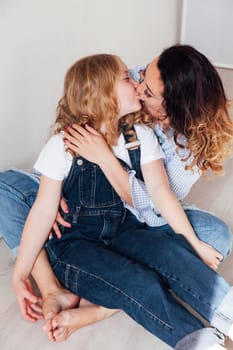 Portrait of a fashionable mom and daughter's family love