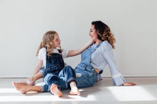 Portrait of a fashionable mom and daughter's family love