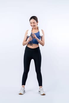 Athletic and sporty asian woman resting and drink water after intensive cardio workout training. Healthy exercising and fit body care lifestyle pursuit in studio shot isolated background. Vigorous