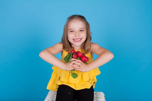 Beautiful girl holds ripe vegetables for food