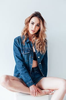 Portrait of a fashionable woman in lingerie and jeans