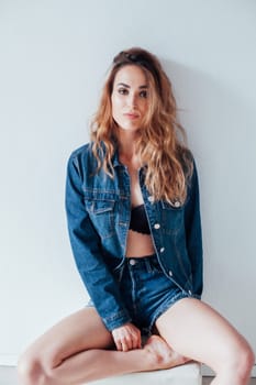 Portrait of a fashionable woman in lingerie and jeans