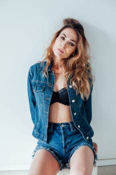 Portrait of a fashionable woman in lingerie and jeans