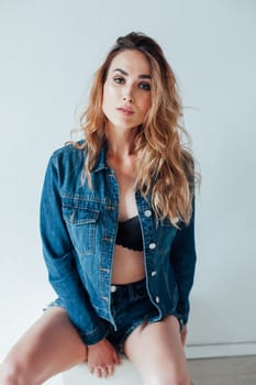 Portrait of a fashionable woman in lingerie and jeans