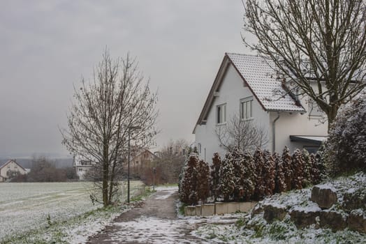 Christmas Tranquility: Winter Wonderland: Snow-Covered European Village Countryside.