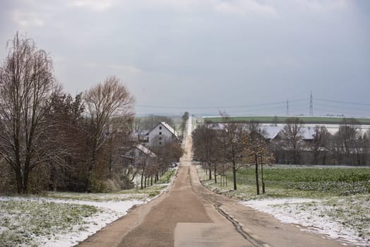 Christmas Tranquility: Winter Wonderland: Snow-Covered European Village Countryside.