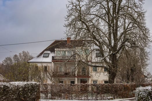 Christmas Tranquility: Winter Wonderland: Snow-Covered European Village Countryside.