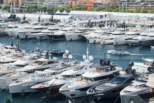 Monaco, Monte Carlo, 27 September 2022 - a lot of luxury yachts at the famous motorboat exhibition in the principality, the most expensive boats for the richest people around the world, yacht brokers. High quality photo