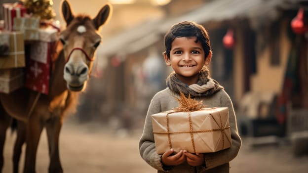 Indian kid with big giftbox is looking to the camera dusty street on background. Christmas support. Give and share kindness