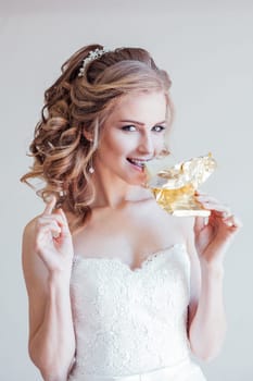 the bride at a wedding in the wedding dress eating white chocolate