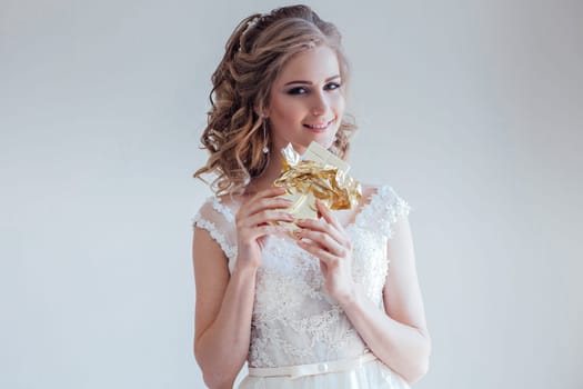 the bride at a wedding in a room eating white chocolate