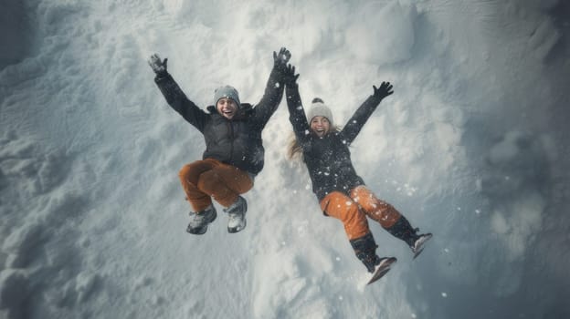 Happy, laughing young people in love skiing on snowy mountains at a ski resort, during vacation and winter holidays, bottom view. Concept of traveling around the world, recreation, winter sports, vacations, tourism in the mountains and unusual places