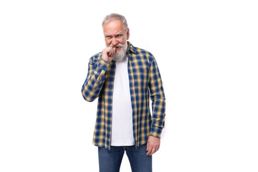 handsome elderly gray-haired retired man with a mustache and beard in a shirt.