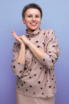 charming young caucasian dark haired lady in skirt and blouse with short haircut.