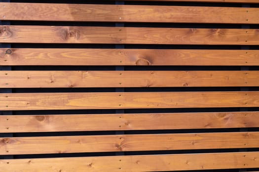 Photo horizontal wooden slats. The texture. Fence.