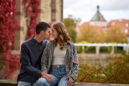 Young Cute Female Hugs Boyfriend. In Autumn Outdoor. Lovers Walking in Park. Attractive Funny Couple. Lovestory in Forest. Man and Woman. Cute Lovers in the Park. Family Concept. Happy Couple.