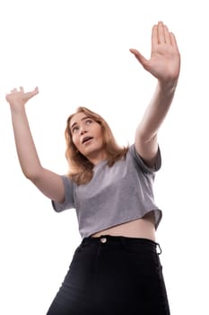 Active teenage girl waving her hands on a white background.