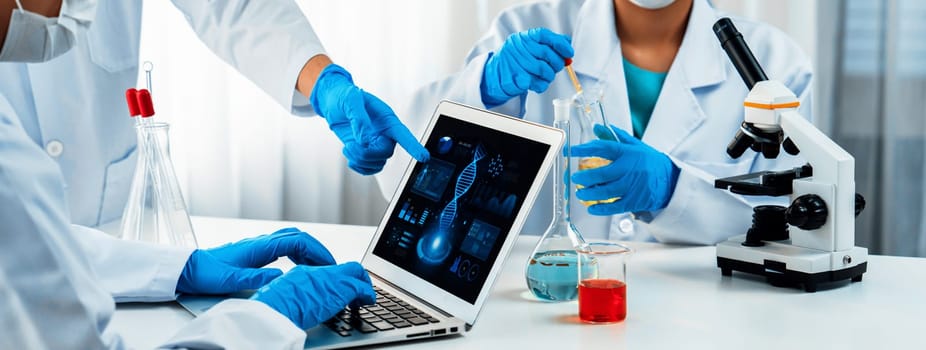 Laboratory research team advance healthcare with scientific expertise, laboratory equipment, and innovative medical biotechnology software, researching new medicines and developing cure.Panorama Rigid