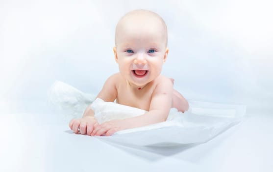 a baby with a hemangioma on his neck lies on a white background. banner with a copy space. profile of a little bald baby girl. the kid looks to the side