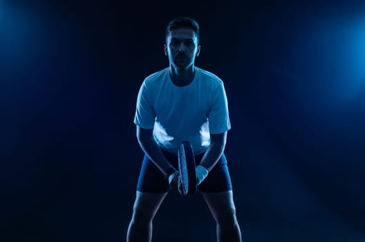 Padel tennis player with racket. Man athlete with racket on court with neon colors. Sport concept. Download a high quality photo for the design of a sports app or betting site