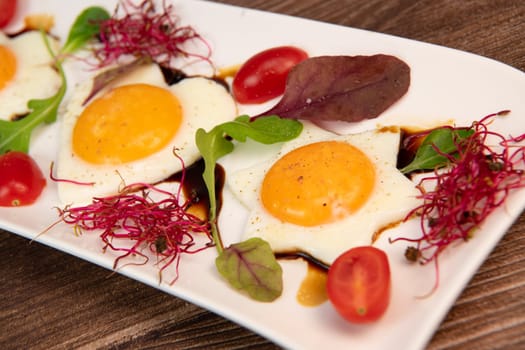 RECIPE FOR FRIED EGGS AND POMEGRANATE MOLASSES CUT INTO HEARTS, STARS AND FLOWERS. High quality photo