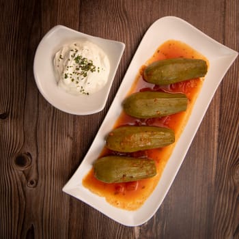 RECIPE FOR LEBANESE-STYLE MINI ZUCCHINI STUFFED WITH RICE AND BEEF IN A TOMATO SAUCE, High quality photo