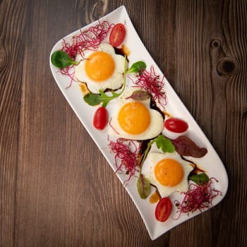 RECIPE FOR FRIED EGGS AND POMEGRANATE MOLASSES CUT INTO HEARTS, STARS AND FLOWERS. High quality photo