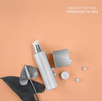 Colors of the year 2024: Peach Fuzz. Makeup cosmetic products, flat lay, top view.
