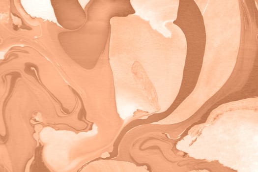 The texture of marble. Spread-out acrylic paint. Abstract background, made in the technique of fluid art. Demonstrating the colors of 2024 - Peach Fuzz.