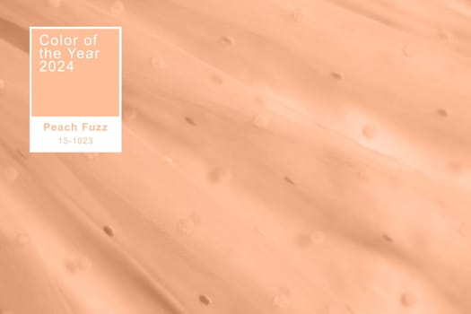 Peach fuzz, color of the year 2024, tulle fabric texture background, textile pattern, copy space.