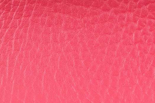 Pink leather texture closeup detailed background.