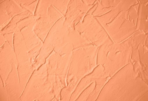 Peach Fuzz toned colour grunge decorative wall background. Art rough stylized texture banner trendy color 2024. Grunge Peach Fuzz color texture. High quality photo