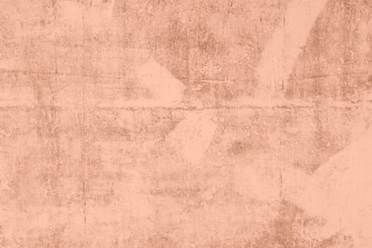 Peach Fuzz toned colour grunge decorative wall background. Art rough stylized texture banner trendy color 2024. Grunge Peach Fuzz color texture. High quality photo